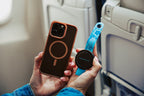 Blue Mo'Bettah Airplane Phone Holder attached to a MagSafe-compatible iPhone