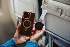 Clear Mo'Bettah Airplane Phone Holder attached to a MagSafe-compatible iPhone