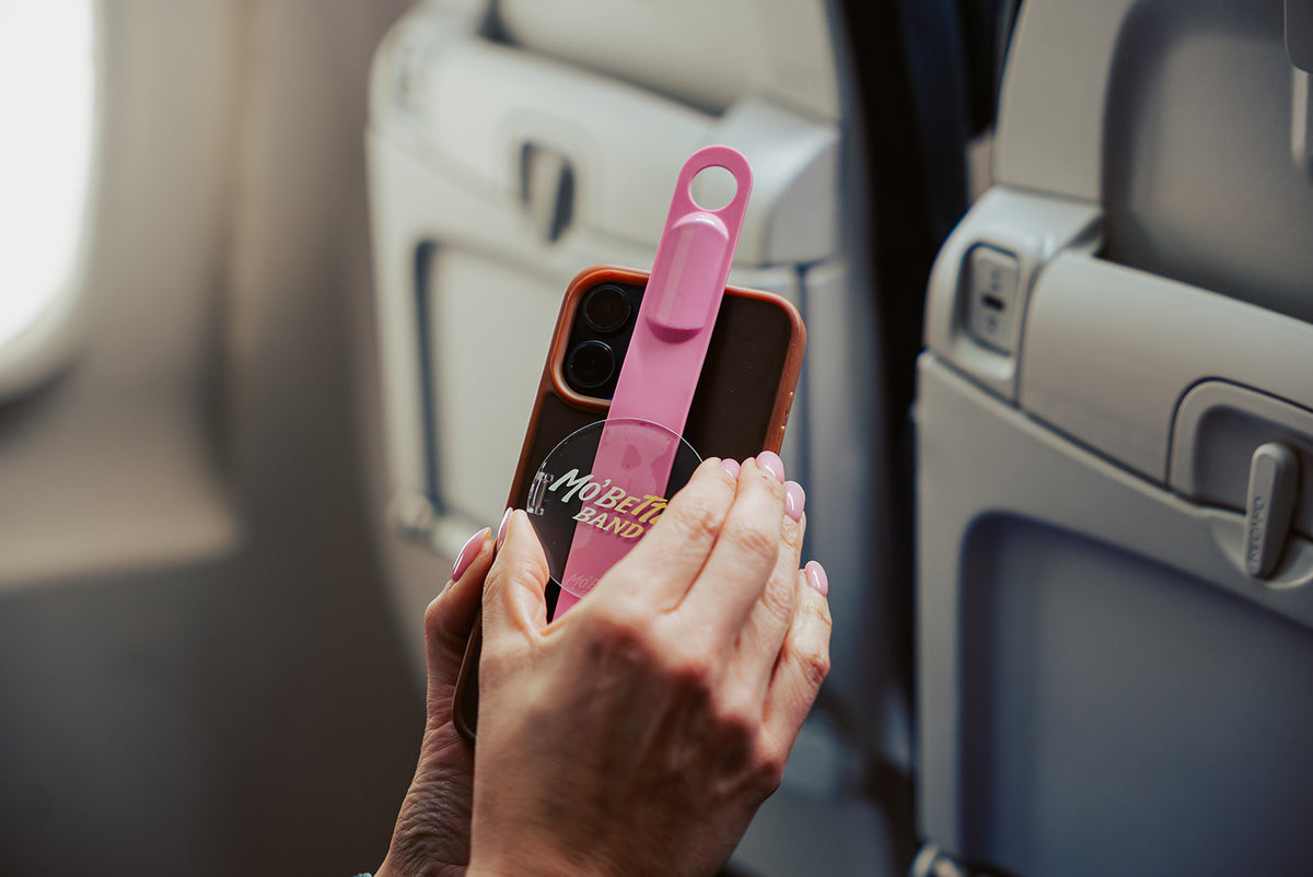 Attaching the Pink Mo'Bettah Airplane Phone Holder to a MagSafe-compatible iPhone